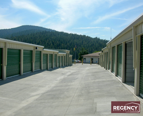 mini storage facility Colorado with green doors and tan exterior