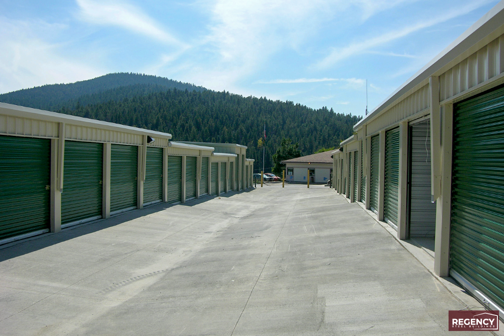 mini storage facility Colorado with green doors and tan exterior