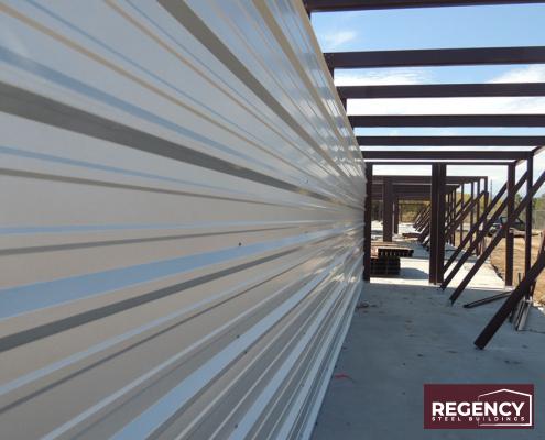 metal building with temporary bracing during erection