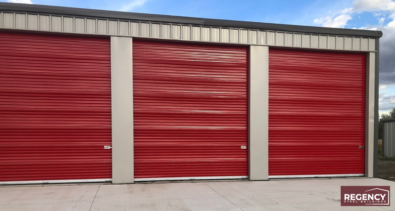 self storage building with red doors and brown trim