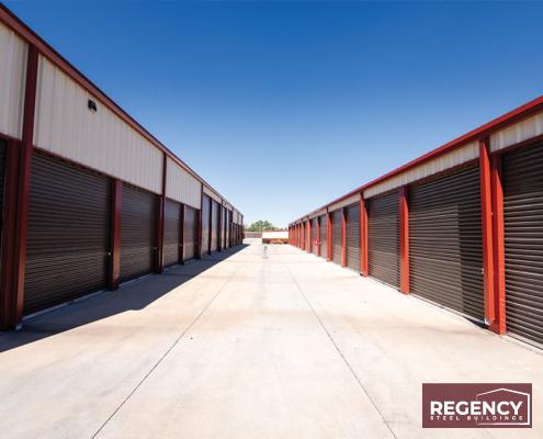mini storage under a clear blue sky, with RV sized doors and a burnt orange trim