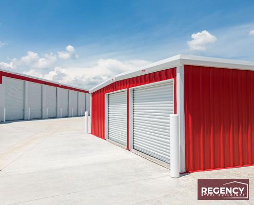 image of mini storage buildings with red walls and white roofs