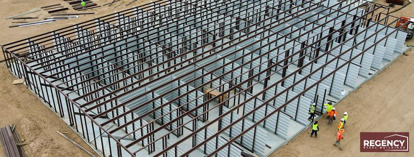 steel building being built, showing the super structure of the building in red iron