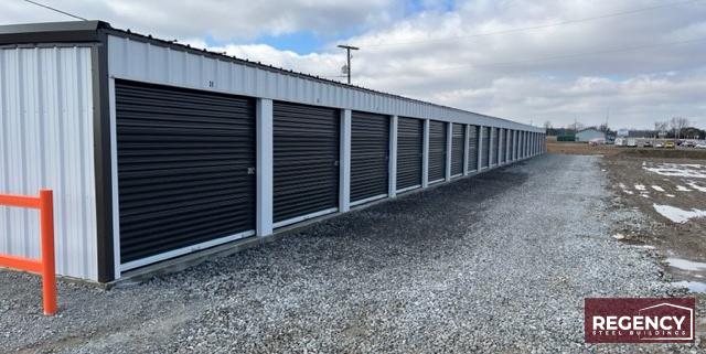 pair of steel mini storage buildings in Alger, Ohio these buildings cater to residential and commercial storage needs. With Light Stone-colored walls and Bronze trim, the facility has an attractive appearance. The buildings feature customizations like gutters, downspouts, and DripX condensation control to ensure durability and protection against water damage. This self-storage facility will provide (86) much-needed storage units, meeting the increasing demand fueled by rising housing costs and remote work trends.