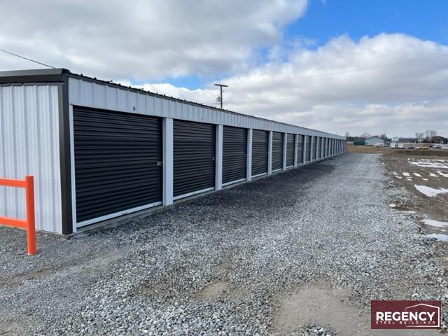 mini-storage-alger-oh pair of steel mini storage buildings in Alger, Ohio these buildings cater to residential and commercial storage needs. With Light Stone-colored walls and Bronze trim, the facility has an attractive appearance. The buildings feature customizations like gutters, downspouts, and DripX condensation control to ensure durability and protection against water damage. This self-storage facility will provide (86) much-needed storage units, meeting the increasing demand fueled by rising housing costs and remote work trends.