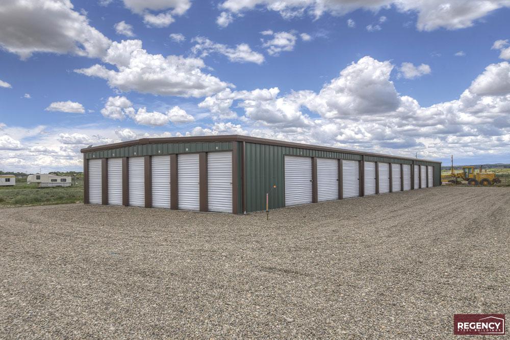 cortez-ministorage green steel mini storage facility with white doors and brown trim