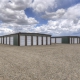 mini storage complex under expansive sky with cumulus clouds
