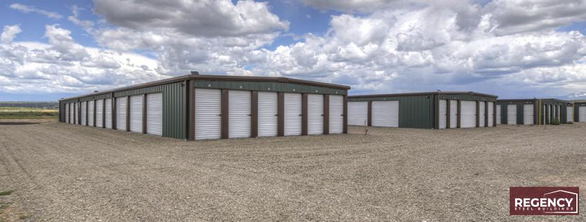 mini storage complex under expansive sky with cumulus clouds