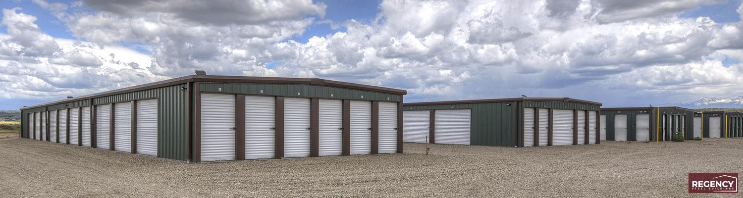 green wall panels, brown trim and white doors mini storage facility